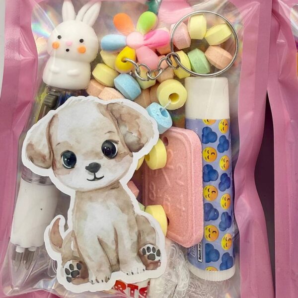 Cute Dogs Pink Filled Party Bag comes pre-filled with a delightful assortment lip gloss, stickers, keyring and much more.