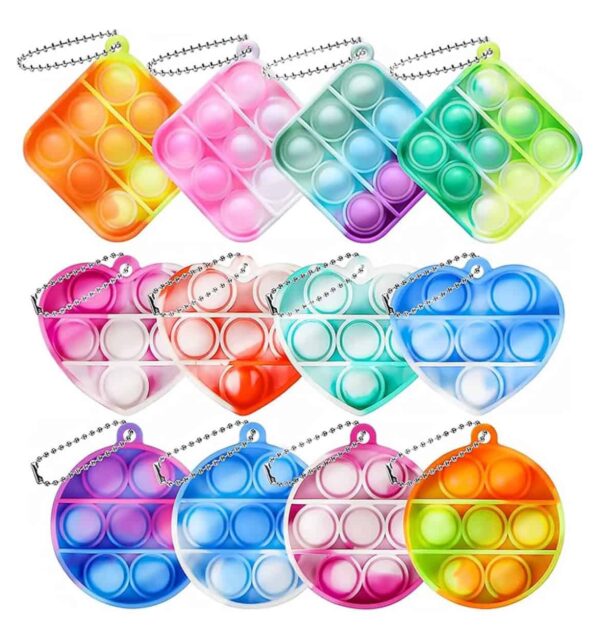 Pop Fidget Toy Keyring have a popping sensation when pushed and the keychain allows ups to out on a backpack easy.