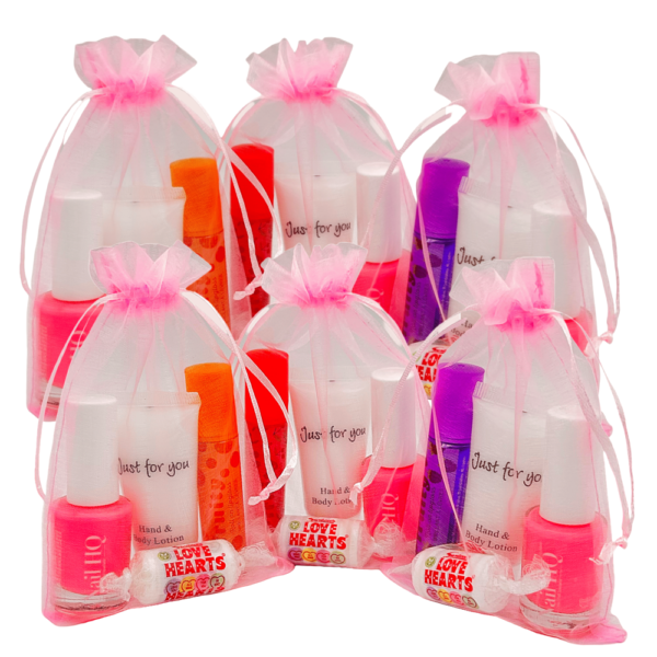 Girls Pink Organza Pamper Party Bags come pre-filled with a variety of lip gloss, nail polish, and other delightful goodies that make for perfect birthday treats.