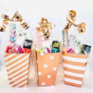 Rose Gold Pamper Treat Box Party Bags come pre-filled with a variety of lip gloss, nail polish, and other delightful goodies that make for perfect birthday treats.