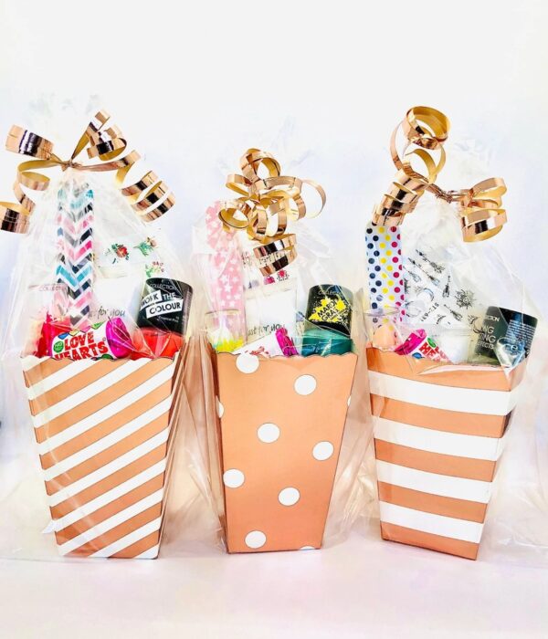 Rose Gold Pamper Treat Box Party Bags come pre-filled with a variety of lip gloss, nail polish, and other delightful goodies that make for perfect birthday treats.