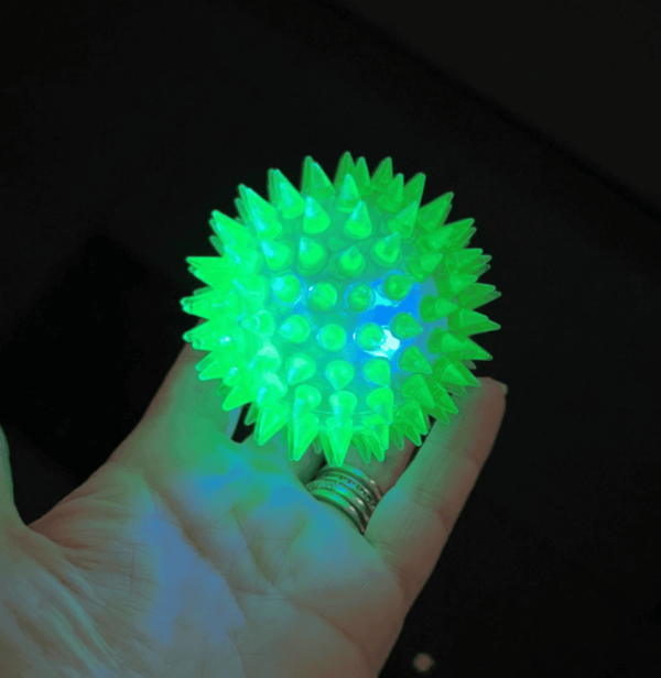 Flashing Spiky Ball – an entertaining accessory suitable for both boys and girls, ages 3 and above. Boasting a 6cm diameter and available in four vibrant colors, these spiky balls are perfect for adding an extra dose of fun to your celebration.