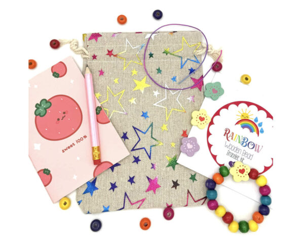 Rainbow Bracelet DIY Eco Friendly Party Bags comes Crafted from eco-friendly cotton, this stylish pre filled party bag contains wooden pencil, memo pad and DIY wooden bracelet kit keeping them occupied.