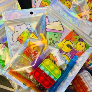 Unisex Holographic Pre Filled Party Pack comes pre-filled with a delightful assortment of sticker, fidget keyring, bubbles, vegan sweets and much more.